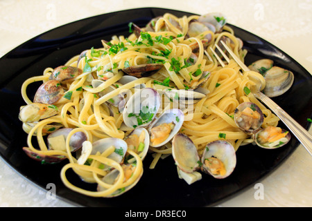 Linguine alle vongole - spaghetti with clams. Stock Photo