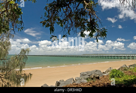Coastal landscape at Hervey Bay, Queensland Australia , with historic Urangan pier,  beach and turquoise ocean under blue sky Stock Photo
