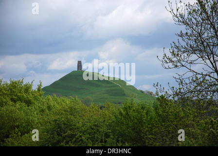 Distant view of Glastonbury Tor from Chalice Well Somerset England United Kingdom Stock Photo