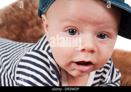Newborn baby in striped clothes Stock Photo