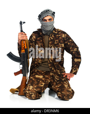 Arab nationality in camouflage suit and keffiyeh with automatic gun on white background with reflection Stock Photo