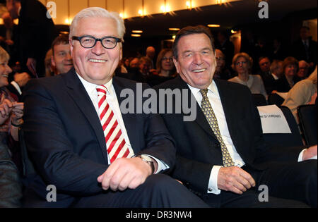 Hamburg, Germany. 19th Jan, 2014. Federal Foreign Minister Frank-Walter Steinmeier (L) and former German Chancellor Gerhard Schroeder (both SPD) smile during his birthday celebration in the Thalia Theatre in Hamburg, Germany, 19 January 2014. Nearly a month after his actual birthday citizens, senate and the weekly journal 'Die Zeit' have invited Hamburg's honorary citizen to congratulate him. Photo: Christian Charisius/dpa/Alamy Live News Stock Photo