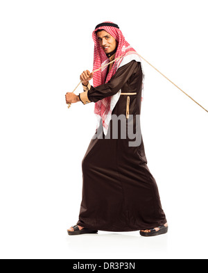 Young Arab pulling a rope isolated on white background Stock Photo