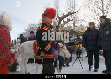 Same leading a Reindeer caravan Jokkmokk fair Laponia Sweden Winter Stock Photo