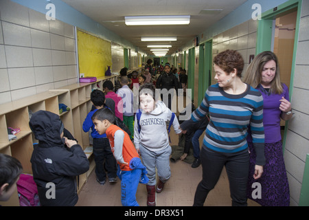 Children in hallway in the morning at an Elementary School, a public school in upper Manhattan, NYC. Stock Photo
