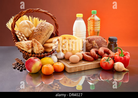 Many daily food ingredients. Set of tasty groceries on mirrored table. Various comestible products. Stock Photo