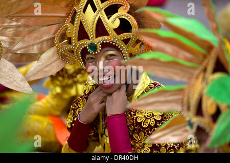 Cebu City, Philippines. 19th Jan, 2014. The nine day Catholic religious festival of Sinulog culminates on the third Sunday of January each year in one of the largest street dancing parades in the Philippines.The festival celebrates the Catholic belief of the holy Child Jesus 'Santo Nino'  Credit:  imagegallery2/Alamy Live News Stock Photo