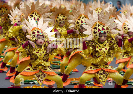 Cebu City, Philippines. 19th Jan, 2014. The nine day Catholic religious festival of Sinulog culminates on the third Sunday of January in one of the largest street dancing parades in the Philippines.The festival celebrates the Catholic belief of the holy Child Jesus 'Santo Nino'  Credit:  imagegallery2/Alamy Live News Stock Photo
