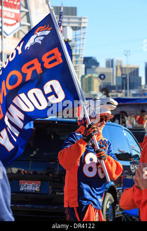 A Denver Broncos Christmas tree is set up as fans tailgate prior to an NFL  football game against the Cincinnati Bengals, Sunday, Dec. 19, 2021, in  Denver. (AP Photo/David Zalubowski Stock Photo 