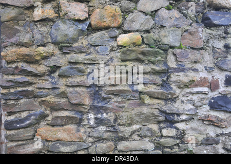 stone wall , old weathered stones, random pattern, greys and browns Stock Photo