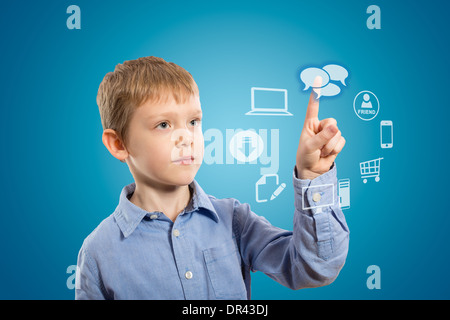 Boy accessing futuristic entertainment applications from the cloud computing interface Stock Photo