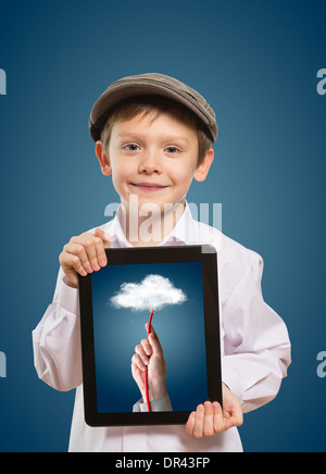 Happy boy with tablet computer. Child showing tablet Stock Photo