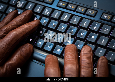 Hacker using laptop. Lots of digits on the computer screen. Stock Photo