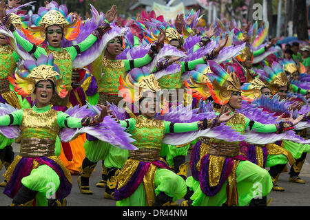 Cebu City,Philippines 19th Jan, 2014.  The nine day Catholic religious festival of Sinulog culminates on the third Sunday of January each year in one of the largest street dancing parades in the Philippines.The festival celebrates the Catholic belief of the holy Child Jesus 'Santo Nino' Credit:  imagegallery2/Alamy Live News Stock Photo
