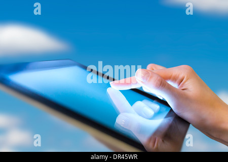 hand presses on screen digital tablet Stock Photo
