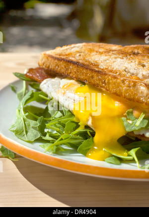 Runny egg breakfast sandwich Stock Photo