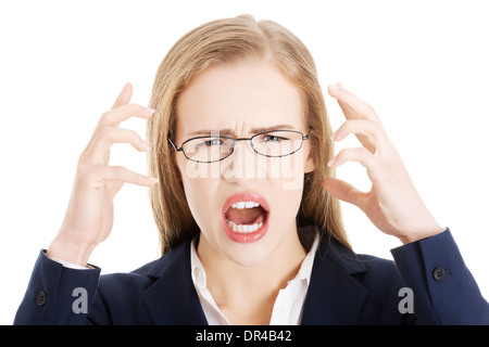 Angry and furious business woman with open mouth is screaming. Isolated on white. Stock Photo