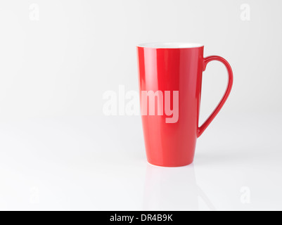 Red tall tea mug isolated on white background Stock Photo