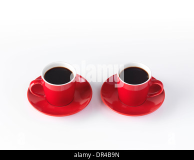 Two red espresso coffee cups isolated on white background Stock Photo