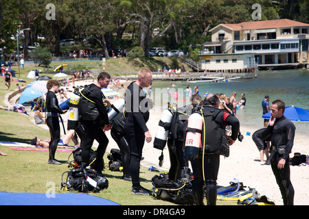 Divers preparing to enter the ocean at Little Beach in Nelson Bay,Port Stephens,australia Stock Photo