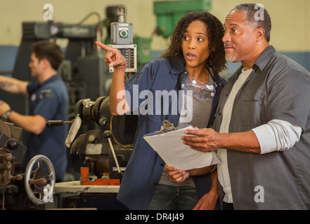 Workers talking in warehouse Stock Photo