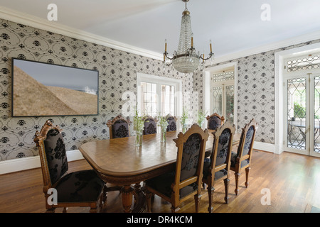 Table and chairs in ornate dining room Stock Photo