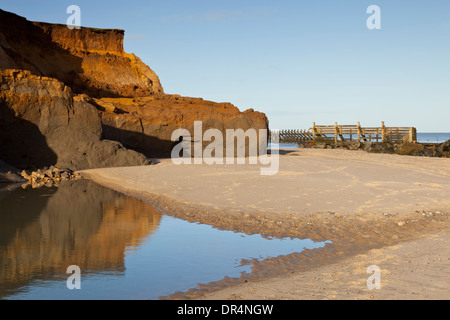 Coastal erosion and sea defences on Happisburgh Beach in Norfolk England Stock Photo