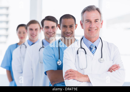 Doctors standing in a row at hospital Stock Photo