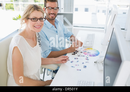 Portrait of photo editors working on computers Stock Photo