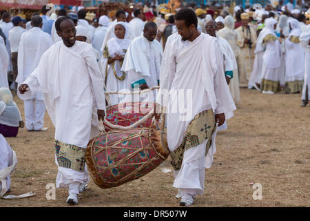 Addis Ababa, Ethiopian . 18th Jan, 2014. Clergymen carry a kebero, a traditional drum made out of animal hide, in preparation for Timket celebrations of Epiphany, on January 18, 2013 in Addis Ababa. Credit:  Dereje Belachew/Alamy Live News Stock Photo