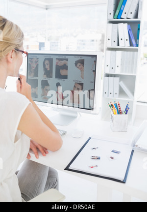 Rear view of a female photo editor working on computer Stock Photo