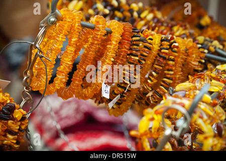 Amber beads and bracelets on the counter. Riga, Latvia Stock Photo