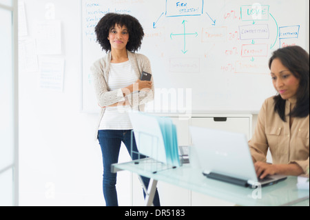 African American businesswomen working in office Stock Photo