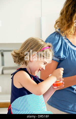 Mother And Daughter In The Kitchen Stock Photo