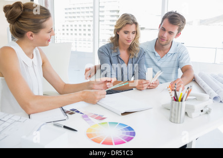 Group of artists working on designs Stock Photo