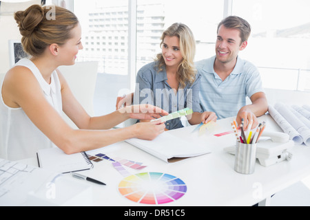 Group of artists working on designs Stock Photo