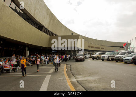 Pasay City, Philippines-January 20, 2014: Departing passengers in front of Manila International Airport Terminal-1. According to Wall Street Cheat Sheet that Manila International Airport (MAI) ranked 8th among the 10 Worst Airports in the World published January 2014. Stock Photo