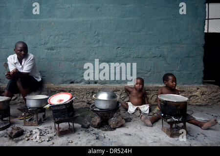 Dec 02, 2008 - Ngangi, Democratic Republic of Congo - Displaced Congolese by a line of charcoal stoves at the Don Bosco center in Ngangi, north of Goma. refugee (Credit Image: © T.J. Kirkpatrick/ZUMA Press) Stock Photo