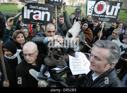 Dec 19, 2008 - London, England, United Kingdom - Stop the War Coalition holding shoes and protesting in front of the US embassy in London. This follows the arrest of al-Zaidi, the Iraqi journalist, who threw his shoes at US president GW Bush during his press conference in Baghdad earlier this week.  (Credit Image: © Tal Cohen/ZUMA Press) RESTRICTIONS: * UK Rights OUT * Stock Photo