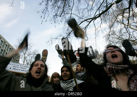 Dec 19, 2008 - London, England, United Kingdom - Stop the War Coalition holding shoes and protesting in front of the US embassy in London. This follows the arrest of al-Zaidi, the Iraqi journalist, who threw his shoes at US president GW Bush during his press conference in Baghdad earlier this week.  (Credit Image: © Tal Cohen/ZUMA Press) RESTRICTIONS: * UK Rights OUT * Stock Photo