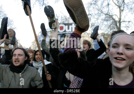 Dec 19, 2008 - London, England, United Kingdom - Stop the War Coalition holding shoes and protesting in front of the US embassy in London. This follows the arrest of al-Zaidi, the Iraqi journalist, who threw his shoes at US president GW Bush during his press conference in Baghdad earlier this week.  (Credit Image: © Tal Cohen/ZUMA Press) RESTRICTIONS: * UK Rights OUT * Stock Photo