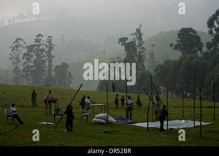 Dec 19, 2008 - Masisi, Democratic Republic of Congo - Concern Worldwide workers build a distribution center near the Lushubere IDP Camp in Masisi. Concern (or Concern Worldwide), is a charitable organisation focused on providing humanitarian aid and development aid to combat extreme poverty in developing countries. Head quartered in Dublin, Ireland, Concern Worldwide was set-up in  Stock Photo