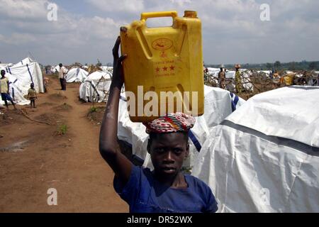 Refugees fetching water during their stay in a refugee camp in Uganda