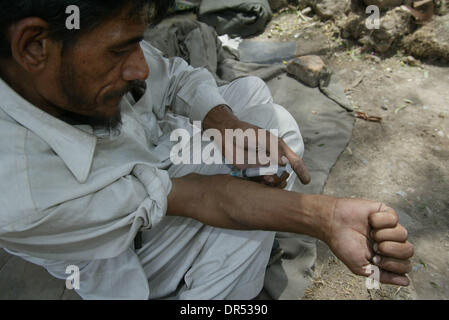 Heroine production in Afghanistan leads to large scale addiction in Afghanistan and Pakistan, especially among the homeless Stock Photo