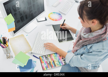 Artist drawing something on graphic tablet at office Stock Photo