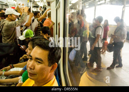 Pasay City, Philippines-January 20, 2014: Passengers of Metro Rail Transit line 3 in Taft Avenue. Stock Photo