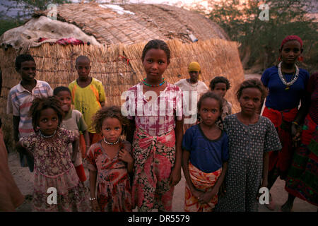 Ethiopian nomad family with their hut and animals Stock Photo