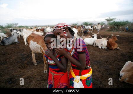 Ethiopian nomad family with their hut and animals Stock Photo