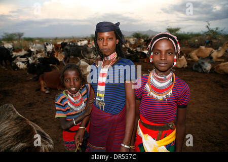 Ethiopian nomad family with their hut and animals Stock Photo