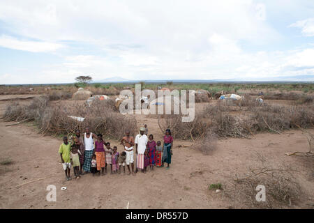 Ethiopian nomad family with their hut and animals Stock Photo